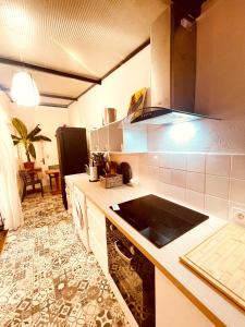 a kitchen with a sink and a counter top at Casa les bambous in Nîmes