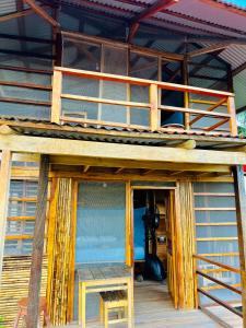 a view of a wooden house with a camera at Reserva Natural Natura Park in Puerto Nariño