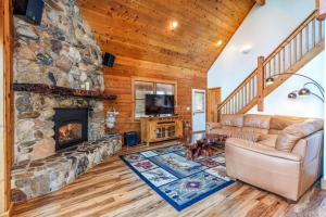 a living room with a stone fireplace at Scenic Wonders & Apt. in Yosemite West