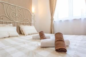 Posteľ alebo postele v izbe v ubytovaní Apartmani Gabi + 37 fotografií