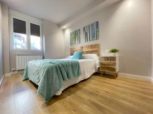A bed or beds in a room at Mk77 - Gran Via