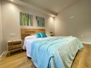 A bed or beds in a room at Mk77 - Gran Via
