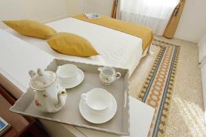 A bed or beds in a room at ELEGANT APARTMENT IN THE HEART OF ROME-NAVONA AREA