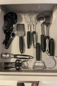 a drawer filled with lots of kitchen utensils at Convenient Home Near Airport in Fort Worth