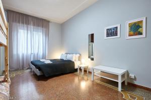 Un pat sau paturi într-o cameră la Casa a San Giovanni