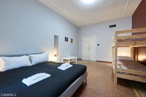 Un pat sau paturi într-o cameră la Casa a San Giovanni