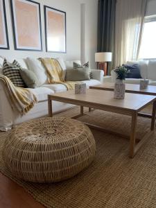 a living room with a couch and a coffee table at Apartamento Luxury Mira Espanha na Guarda in Guarda