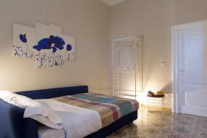 a bedroom with a bed and a door to a room at A un passo dal Colosseo in Rome