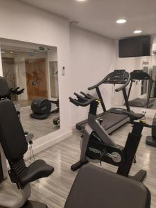 a gym with several exercise bikes and a treadmill at Apartamento María Mendoza in Ardales
