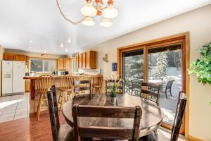 a kitchen and dining room with a table and chairs at Twenty Grand Chalet in Silverthorne