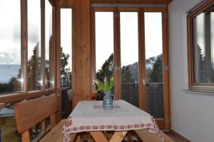 a room with a table with a vase of flowers on it at Ferienhaus Ferch in Turracher Hohe