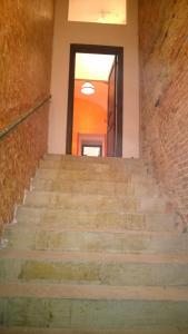 a set of stairs leading up to a door at M Central Apartments in Cluj-Napoca