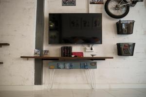 TV a/nebo společenská místnost v ubytování Casa suig