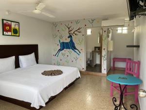 Cama ou camas em um quarto em Blue Coconut Cancun Hotel