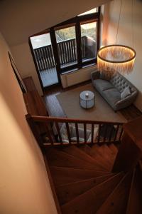 an overhead view of a living room with a couch at Apartment Vila Aston in Veľká Lomnica