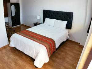 Letto o letti in una camera di Hostal Cusco de mis Sueños