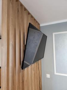 a flat screen tv hanging on a wall at Smart Studio 76 -2 in Onești