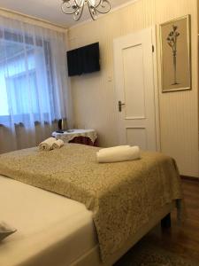 Łóżko lub łóżka w pokoju w obiekcie Villa Almira