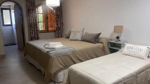 Cama ou camas em um quarto em Terra Campo Posada