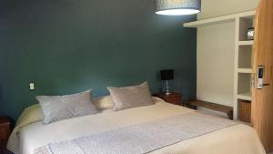 Cama ou camas em um quarto em Terra Campo Posada