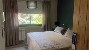 Cama ou camas em um quarto em Terra Campo Posada