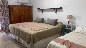 Cama ou camas em um quarto em Terra Campo Posada