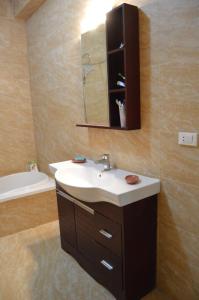 a bathroom with a sink and a mirror at Askyhomes in Hurghada