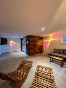 a living room with a couch and a table at Alm'a Residence in Kitzbühel