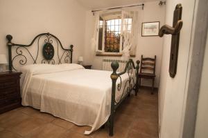 Postel nebo postele na pokoji v ubytování Agriturismo Podere Valdo