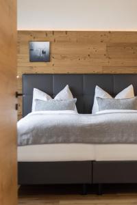 Łóżko lub łóżka w pokoju w obiekcie Apartments am Bichl