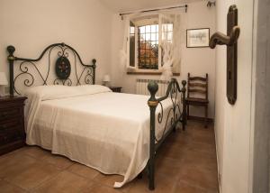 Postel nebo postele na pokoji v ubytování Agriturismo Podere Valdo