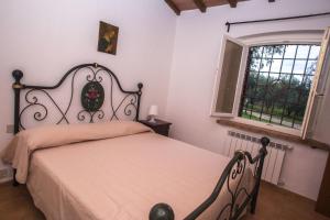 Postel nebo postele na pokoji v ubytování Agriturismo Podere Valdo