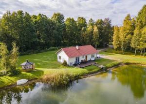 an aerial view of a house next to a lake at Ninnujärve Private Holiday Home in Nasva