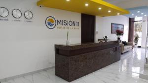 a lobby of a museum with a reception desk at HOTEL MISION 11 in Tijuana