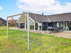 a soccer net in the yard of a house at 14 person holiday home in H jslev in Sundstrup