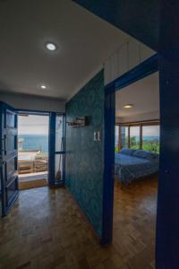 En eller flere senge i et værelse på CASA PARAISO AZUL REÑACA