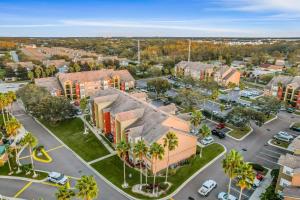 an aerial view of a city with palm trees at Villa del Sol #324 in Kissimmee