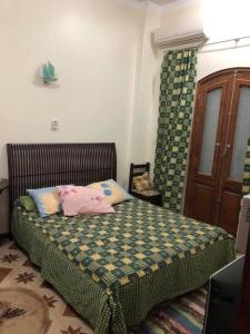 a bedroom with a bed in a room with a door at Sunny sea in Quseir