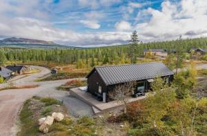 an aerial view of a small house with a road at Hytte Trysil SPA in Trysil