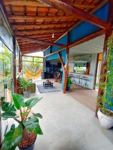 a patio with plants in a house at Pousada Hostel Legatum - Próximo a BR 101 e Boulevard Shopping in Campos dos Goytacazes +23 photos