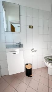 a bathroom with a sink and a toilet at Appartameno Calnova in Vodnjan