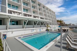 a swimming pool in front of a hotel at Inn on Destin Harbor, Ascend Hotel Collection in Destin