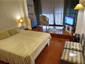 Ένα ή περισσότερα κρεβάτια σε δωμάτιο στο Departamento Rebagliatti 170