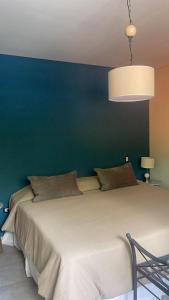 Cama ou camas em um quarto em Terra Campo Posada