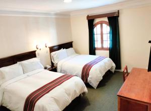 Ένα ή περισσότερα κρεβάτια σε δωμάτιο στο Hotel Presidente Huancavelica - Asociado Casa Andina