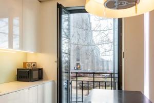 a kitchen with a window with a view of a building at Stay Iceland apartments - S 46 in Reykjavík