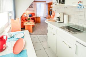 a kitchen and living room with an open floor plan at Haus Petra 134 - Ferienwohnung 4 in Juist