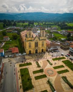 an aerial view of a church in a city at Casa rodante encantadora en el corazón de Boyacá! in Firavitoba