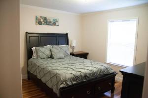 a bedroom with a bed and a window at Home on 30 acres next to State Park in Sampson
