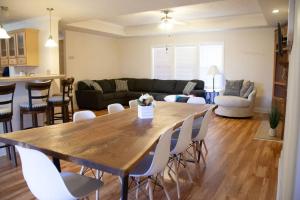 a kitchen and living room with a wooden table and chairs at Home on 30 acres next to State Park in Sampson